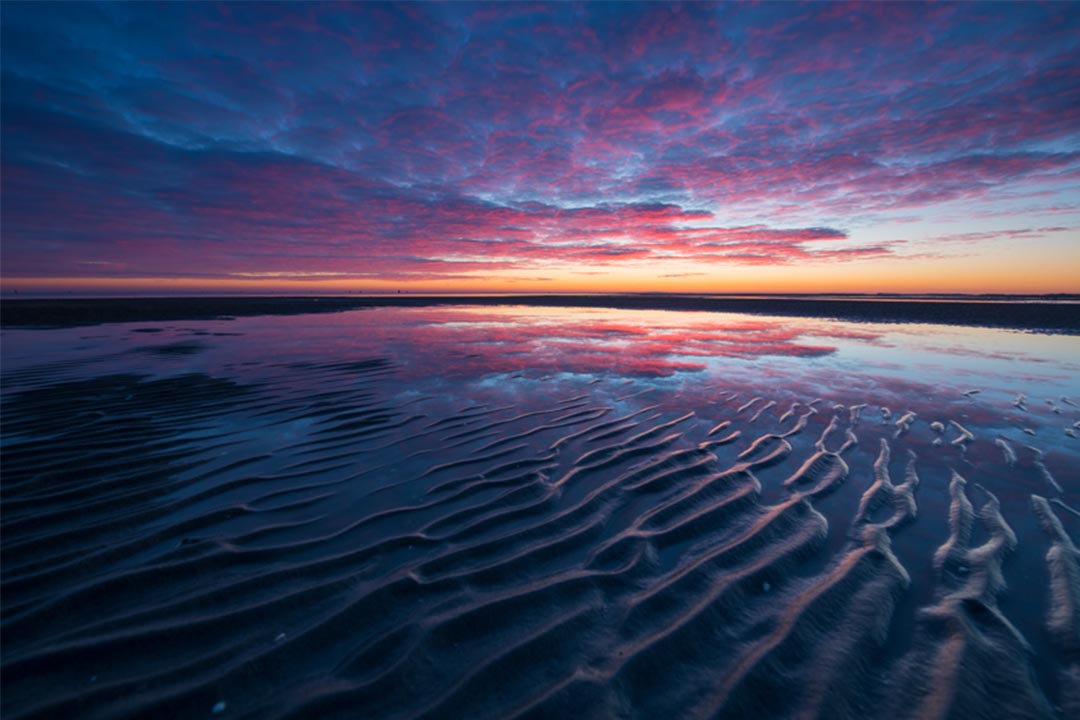 Zonsondergang Groene strand